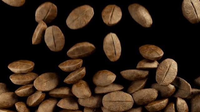 Falling coffee beans in slow motion filling the screen