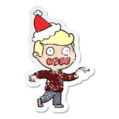 distressed sticker cartoon of a stressed out pointing wearing santa hat