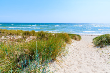 Fototapeta na wymiar Entrance to beach and sand dunes in Lobbe village, Ruegen island, Baltic Sea, Germany