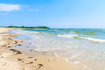 View of beach and sea waves in Lobbe village, Ruegen island, Baltic Sea, Germany
