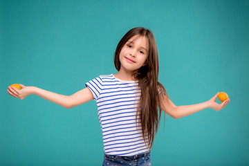 Teen girl juggles eggs and happily smiles, Copy space,baby girl with Easter eggs,concept of Easter