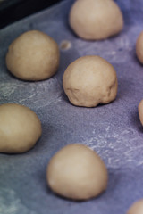 Small Bread Dough Balls Placed on Cooking Paper on Pan - Ready to be Baked, Kitchen Set