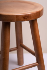 Handcrafted wooden backless stool on white background isolated