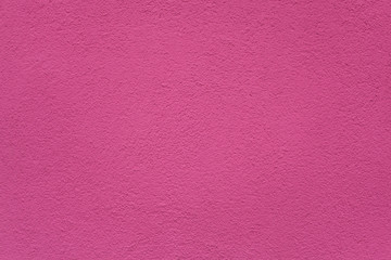 Pink painted stucco wall. Background texture.