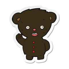 sticker of a cartoon waving black bear cub