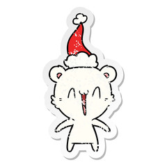 happy polar bear distressed sticker cartoon of a wearing santa hat