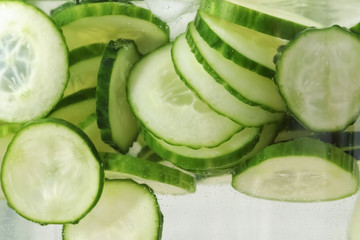 Large jar of fresh cucumber water, closeup