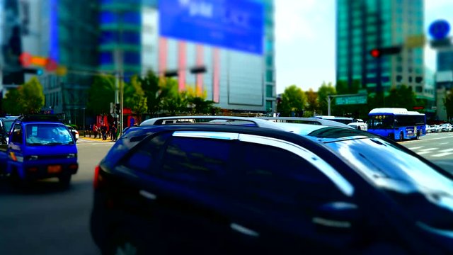 Panning timelapse video of the traffic in Seoul, the capital of South Korea during daytime in miniature effect