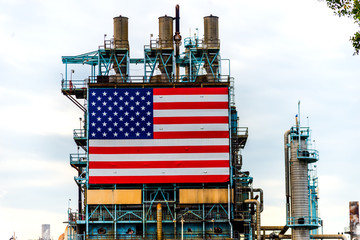 Large American Flag affixed to oil refinery