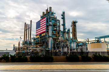Large American Flag affixed to oil refinery