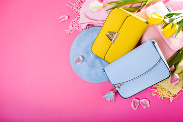 Spring female clothes and accessories with tulips. Stylish handbags with beret, scarf and flowers....