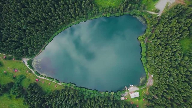 hd drone footage, over azure triangle lake, reflecting sky and clouds, in Artvin, Savsat Karagol Turkey