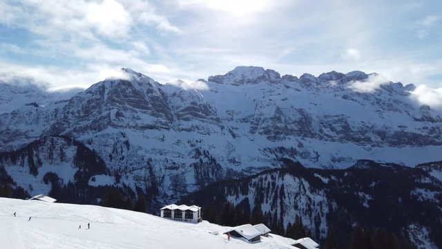 A bright and sunny day on a mountain covered in snow