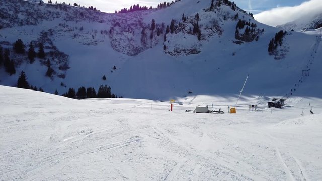 skiing downhill on a bright day