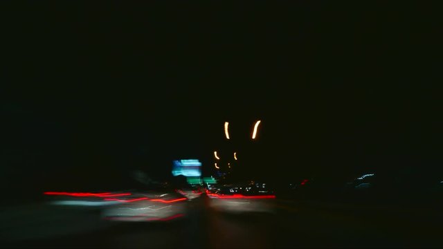 Time lapse of traffic as it moves through city streets at a breakneck speed. Concept: speed,blur,motion,light trails