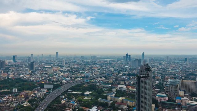Time lapse cityscape view with a traffic movement urban concept. amazing view of clouds and with a blue sky.