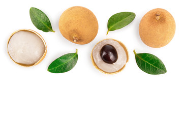 Fresh longan fruit with leaves isolated on white background. Top view. Flat lay