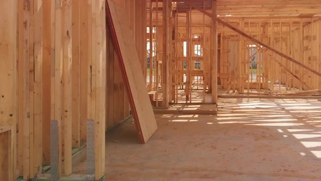 dolly push into a new construction home showing studs