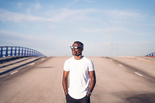 Handsome African Man In White Shirt Posing At Camera