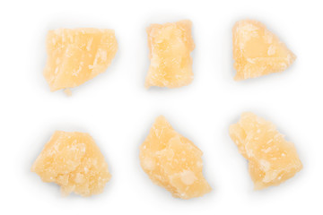 Parmesan cheese pieces isolated on white background. Closeup. Top view. Flat lay