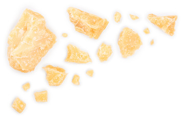 Parmesan cheese pieces isolated on white background with copy space for your text. Closeup. Top view. Flat lay