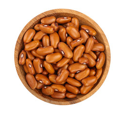 brown kidney bean in wooden bowl isolated on white background. Top view. Flat lay
