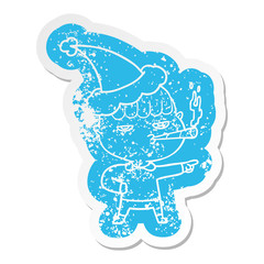 cartoon distressed sticker of a man smoking wearing santa hat