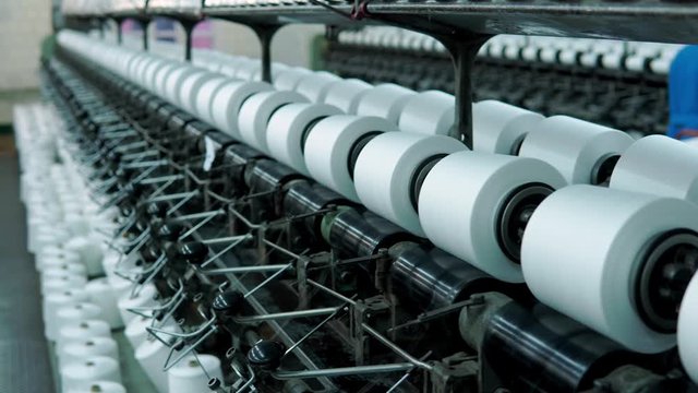 old knitted fabric. Textile factory in spinning production line and a rotating machinery and equipment production company.