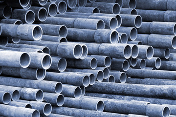 Pile of metal pipes as industrial background