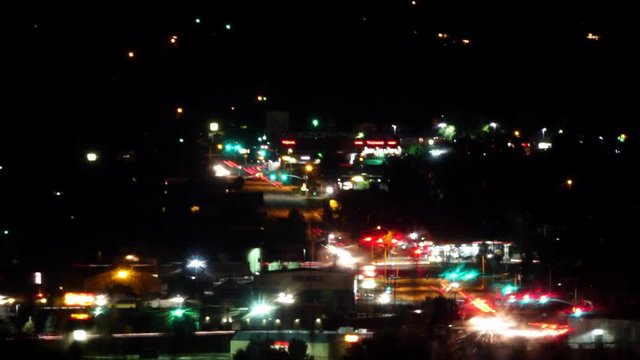 Time-lapsed shot of streaking traffic and street lights at night.