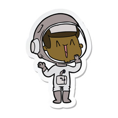 sticker of a laughing cartoon astronaut
