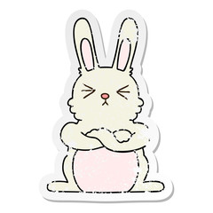 distressed sticker of a quirky hand drawn cartoon rabbit
