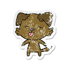 distressed sticker of a cartoon dog sticking out tongue