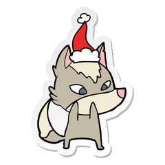 shy sticker cartoon of a wolf wearing santa hat