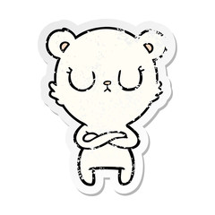 distressed sticker of a peaceful cartoon polar bear