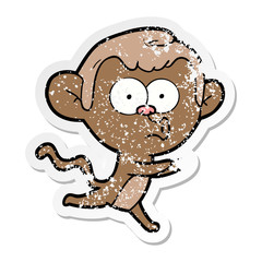 distressed sticker of a cartoon hooting monkey