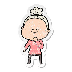 distressed sticker of a cartoon happy old woman