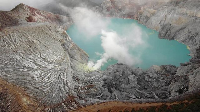 Stunning aerial footage moving towards the Ijen crater in Banyuwangi Regency of East Java, Indonesia.