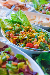 Assortment of fresh vegetable salads in restaurant buffet