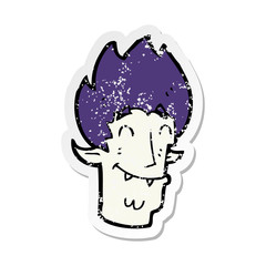 retro distressed sticker of a cartoon happy vampire head