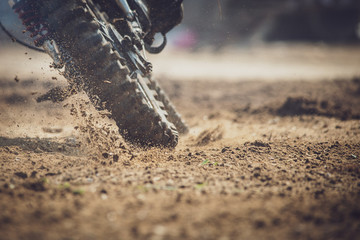 Fototapeta na wymiar Muddy Wheel Motocross Bike spin