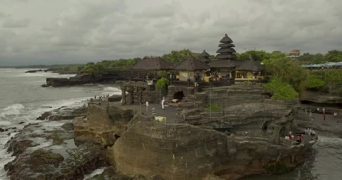 Breathtaking aerial view of Pura Tanah Lot. Tanah Lot is a rock formation off the Indonesian island of Bali.