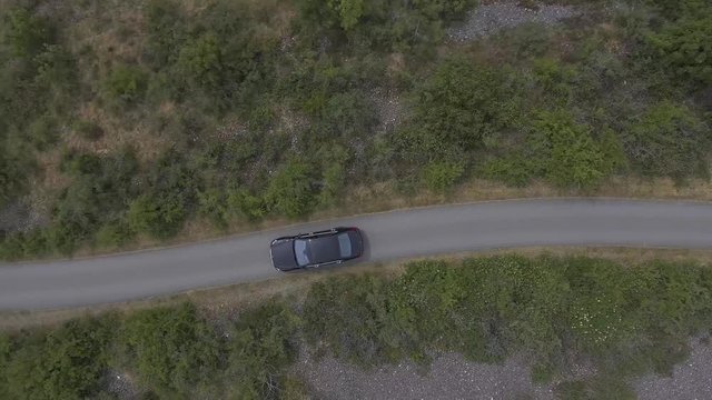Aerial Footage of Luxury Mercedes Benz AMG driving on road.