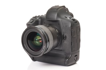 Fototapeta premium DSLR camera on a desk