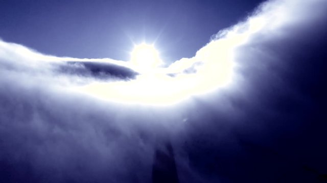 Absolutely mesmerizing 4K footage of fast flowing cloud cover and intense sunlight with a dark roadway in the shadows below.  Perfect for storytelling, themed presentations or quality B-Roll.
