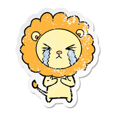distressed sticker of a cartoon crying lion