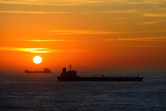 Cargo ships lying on roadstead at sunrise, Rio de Janeiro, Brazil, South America