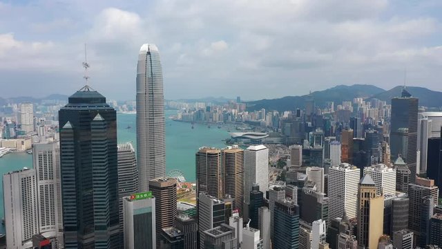 sunny day hong kong cityscape downtown skyscraper tops aerial panorama 4k