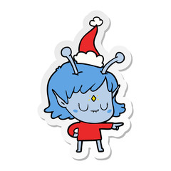 sticker cartoon of a alien girl wearing santa hat