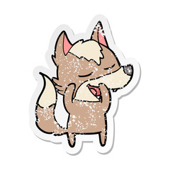 distressed sticker of a cartoon wolf laughing